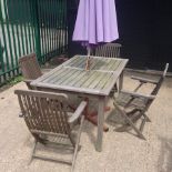 A teak slatted garden table, 150 x 90cm,