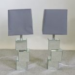 A pair of mirrored table lamps and shades,