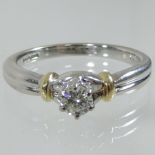 An 18 carat gold and diamond solitaire ring,