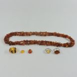 A small collection of amber coloured jewellery,