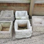 A collection of five garden planters,