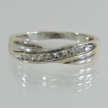 An 18 carat white gold eternity ring, of twist design,