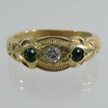 An 18 carat gold, emerald and diamond ring,