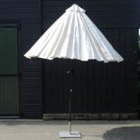 A cream garden parasol,