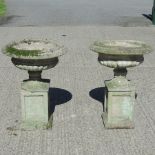 A near pair of reconstituted stone planters,