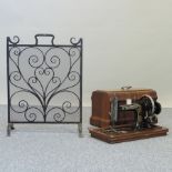 A black painted wrought iron fire screen, 62cm,