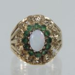 A 9 carat gold opal and emerald cluster ring,