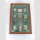 A golfing trophy display, cased,