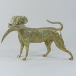 A brass door stop, in the form of a dog holding a pheasant,