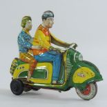 A 1960's painted tinplate clockwork toy motorcycle, marked DBGM,