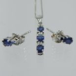 A white gold sapphire and diamond necklace set,