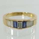 An 18 carat gold sapphire and diamond baguette cut ring