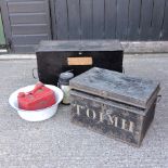 A black painted tin trunk, 73cm, together with two smaller,