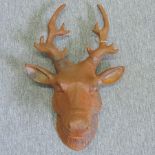 A rusted metal model of a deer head,