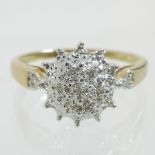 A 9 carat gold and diamond cluster ring