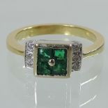 An 18 carat gold, emerald and diamond dress ring, boxed,