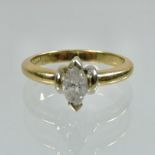 An 18 carat gold marquise cut diamond ring