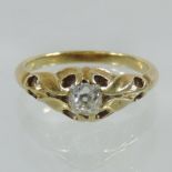 An unmarked yellow metal single stone diamond ring, approximately 0.