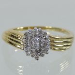 An 18 carat gold diamond cluster ring,
