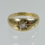 An 18 carat gold and diamond gypsy ring
