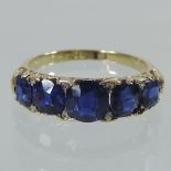 An 18 carat gold sapphire and diamond dress ring,