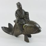 A Chinese bronze incense burner, in the form of a man on a carp,