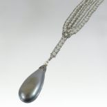 An early 20th century grey pearl pendant, 4cm tall,