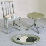 A green painted occasional table, together with a chair and an oval wall mirror,