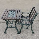 A wooden and metal garden table, together with a bench,