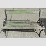 A cast iron and wooden slatted garden bench,