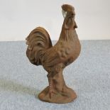 A cast iron model of a cockerel,