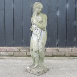 A reconstituted stone garden figure of a lady,