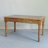 An early 20th century Victorian light oak desk,
