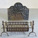 A large cast iron fire back, of arched shape, relief decorated with a rampant lion, 76cm wide,