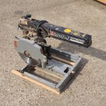 A Dewalt electric cross cut saw,