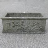 A reconstituted stone garden trough,