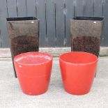 A pair of red garden pots, 42cm diameter, together with a pair of tall brown garden pots,