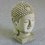 A marble effect head of a buddha,