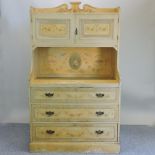 An early 20th century cream painted dresser, decorated with flowers,