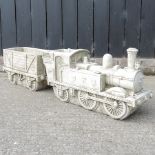 A reconstituted stone model of a train and carriage,