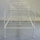 A painted iron single bedstead,