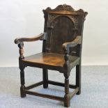 A 17th century style oak wainscot chair,