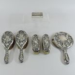 An early 20th century silver backed dressing table set, with relief decoration, stamped Rd.