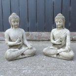 A pair of reconstituted stone garden models of seated buddhas,