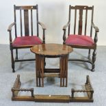 A pair of 1920's oak open arm chairs,