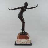 An Art Deco style bronzed figure of lady, on a marble base,