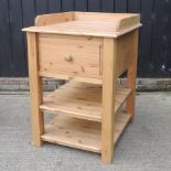 A modern pine side table, with a single drawer,