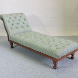 A Victorian green upholstered chaise longue,