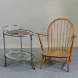 An Ercol light elm chair, together with a 1950's chrome hostess trolley,