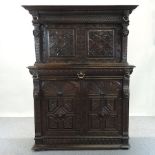 A 19th century continental heavily carved dark oak side cabinet, with cupboards below,